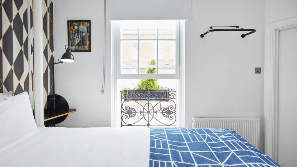 Modern bedroom with heritage sash windows by Fairco