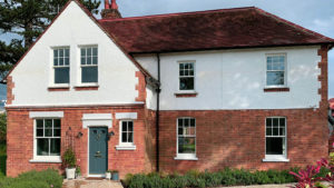 Redbrick house with Fairco Heritage Sash Windows
